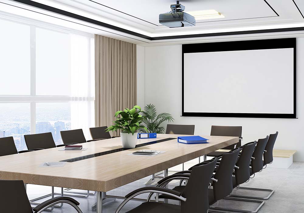 An empty meeting room with a table and chair surrounding it