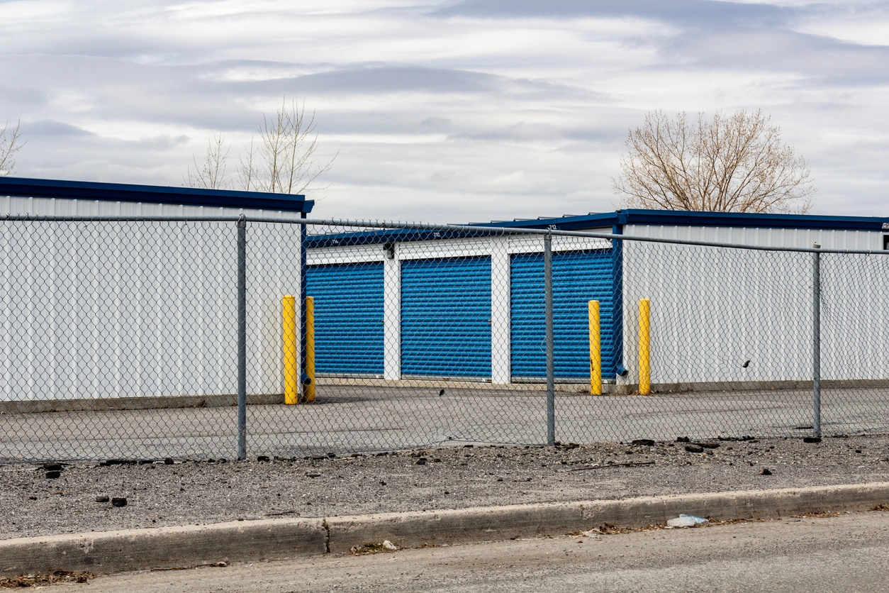 self storage facility surveillance cameras monitoring gate and unit rows