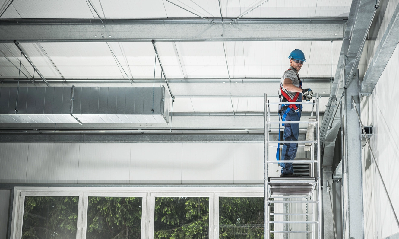 commercial security camera technician installing surveillance system