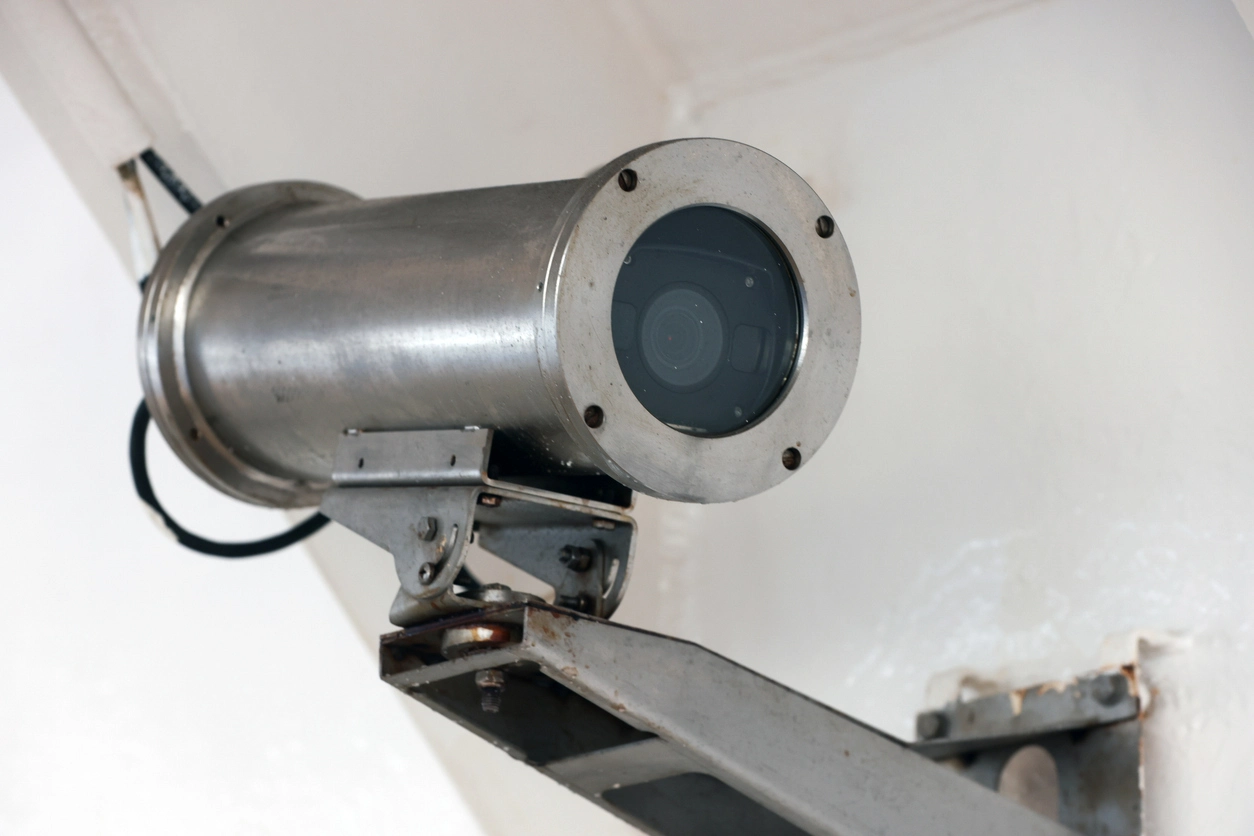 technician installing explosion proof camera housing in industrial environment