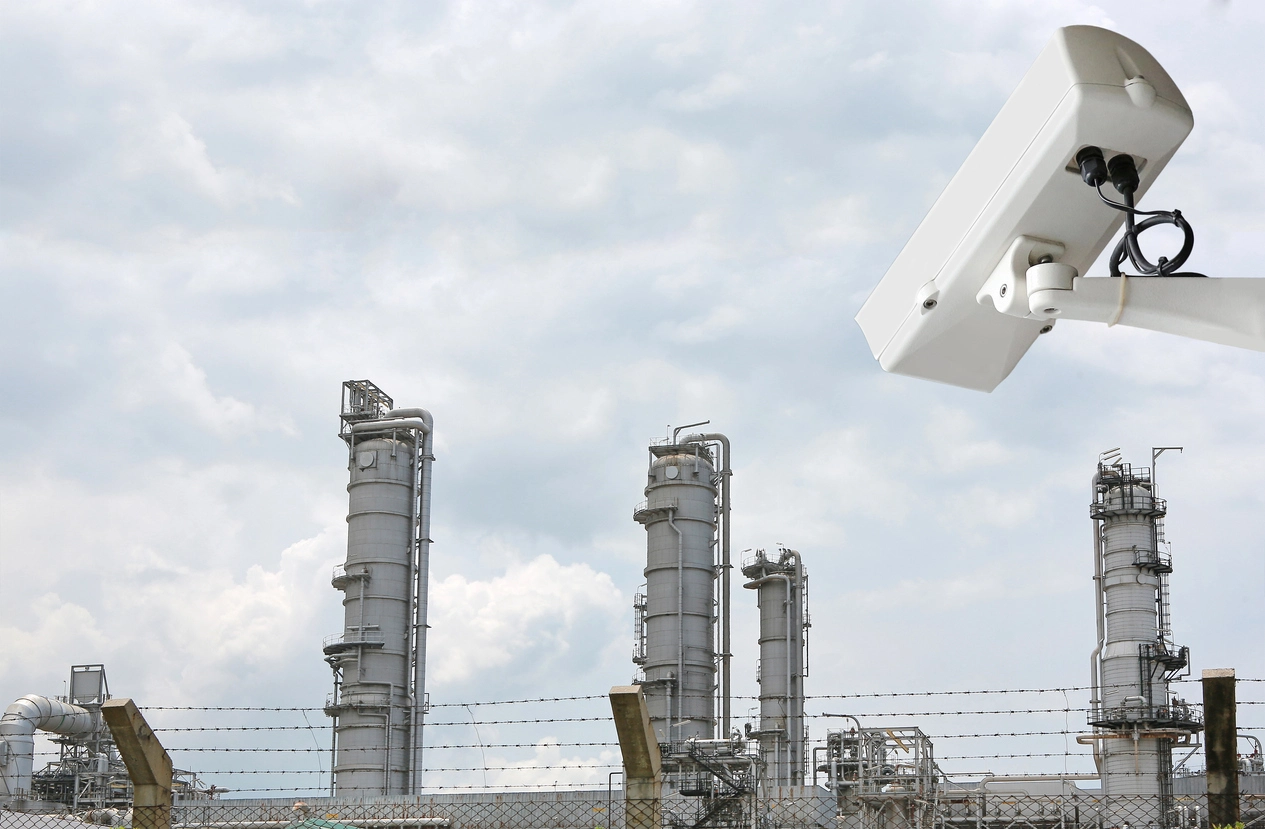 rugged industrial security camera monitoring a heavy industrial facility