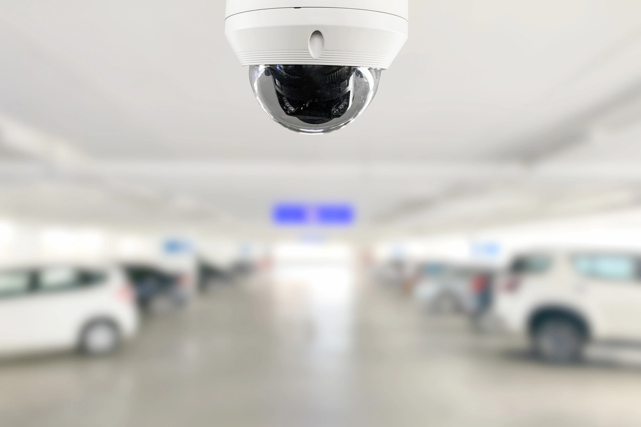 fisheye security camera mounted on ceiling monitoring wide commercial interior