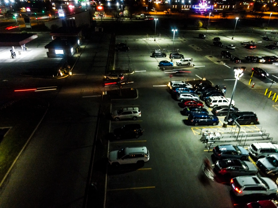 commercial parking lot monitored by infrared security cameras at night