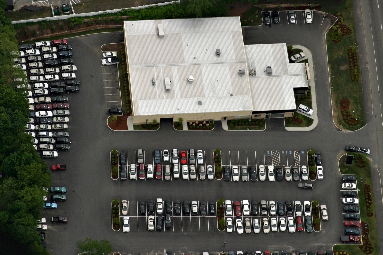 license plate recognition camera monitoring a commercial parking lot entrance