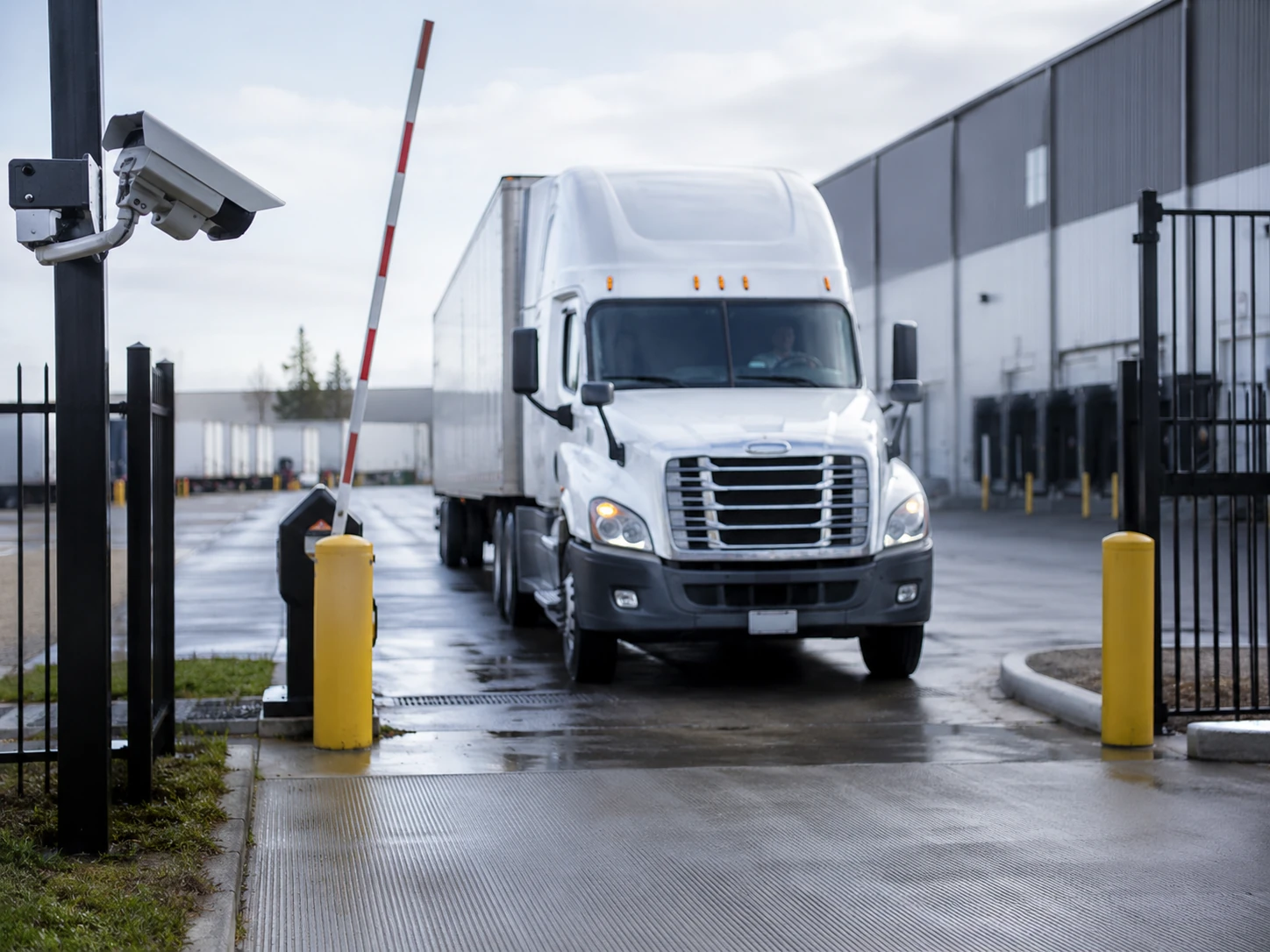 license plate recognition camera monitoring a truck lane at a warehouse