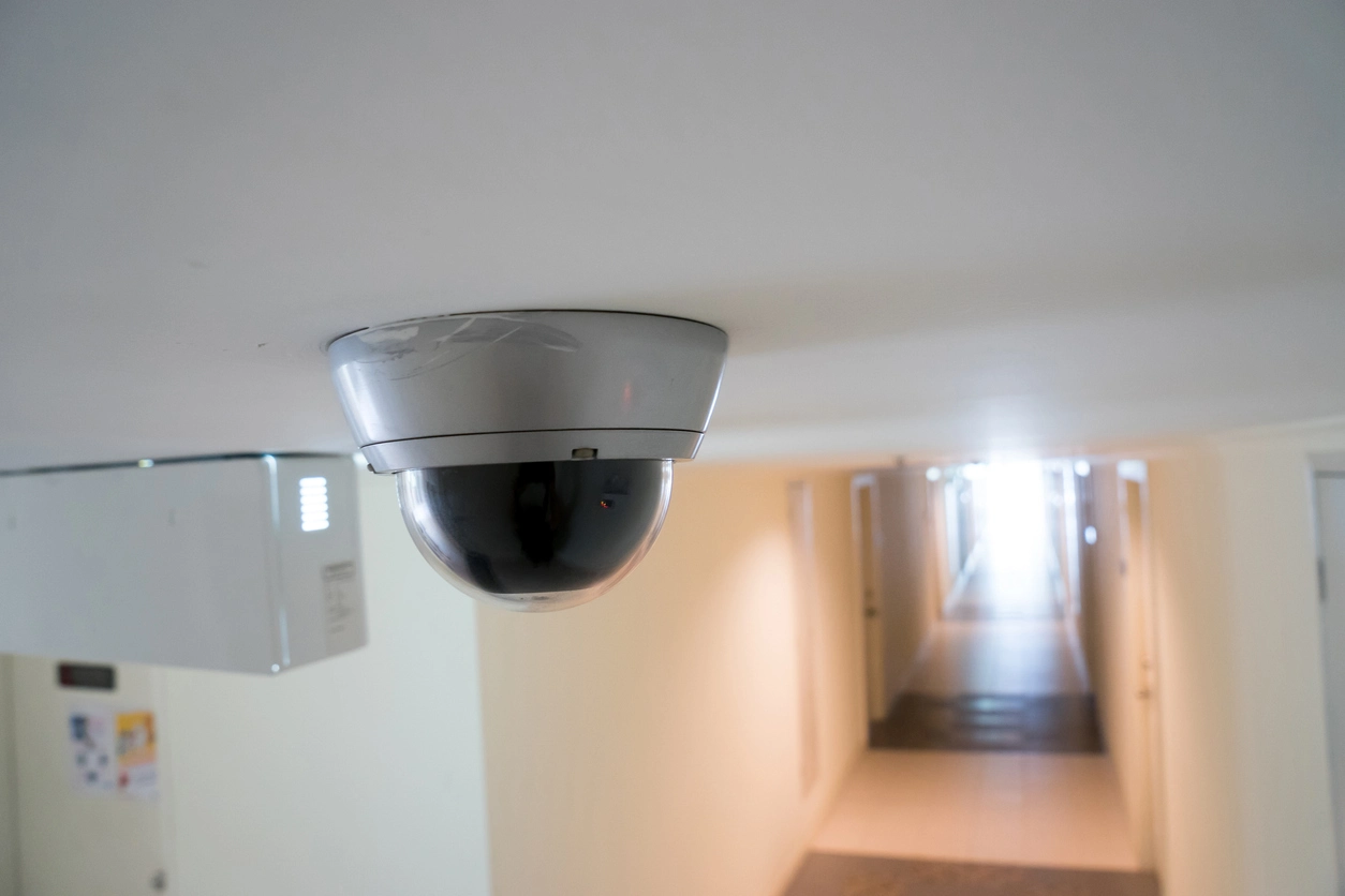 motion activated security camera monitoring commercial office hallway