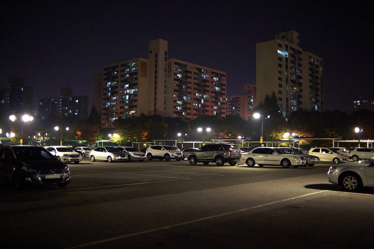 motion activated camera monitoring commercial parking lot at night