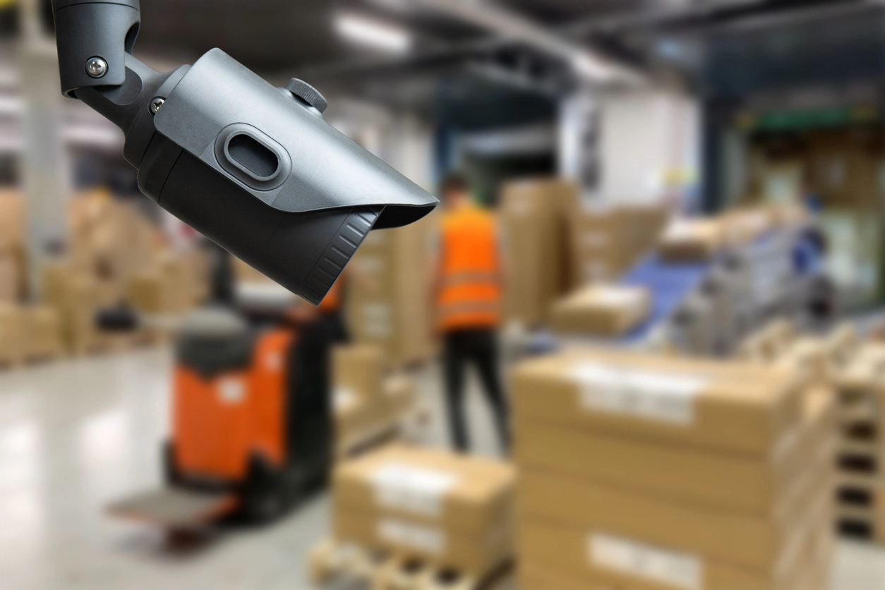motion activated security camera monitoring warehouse storage area