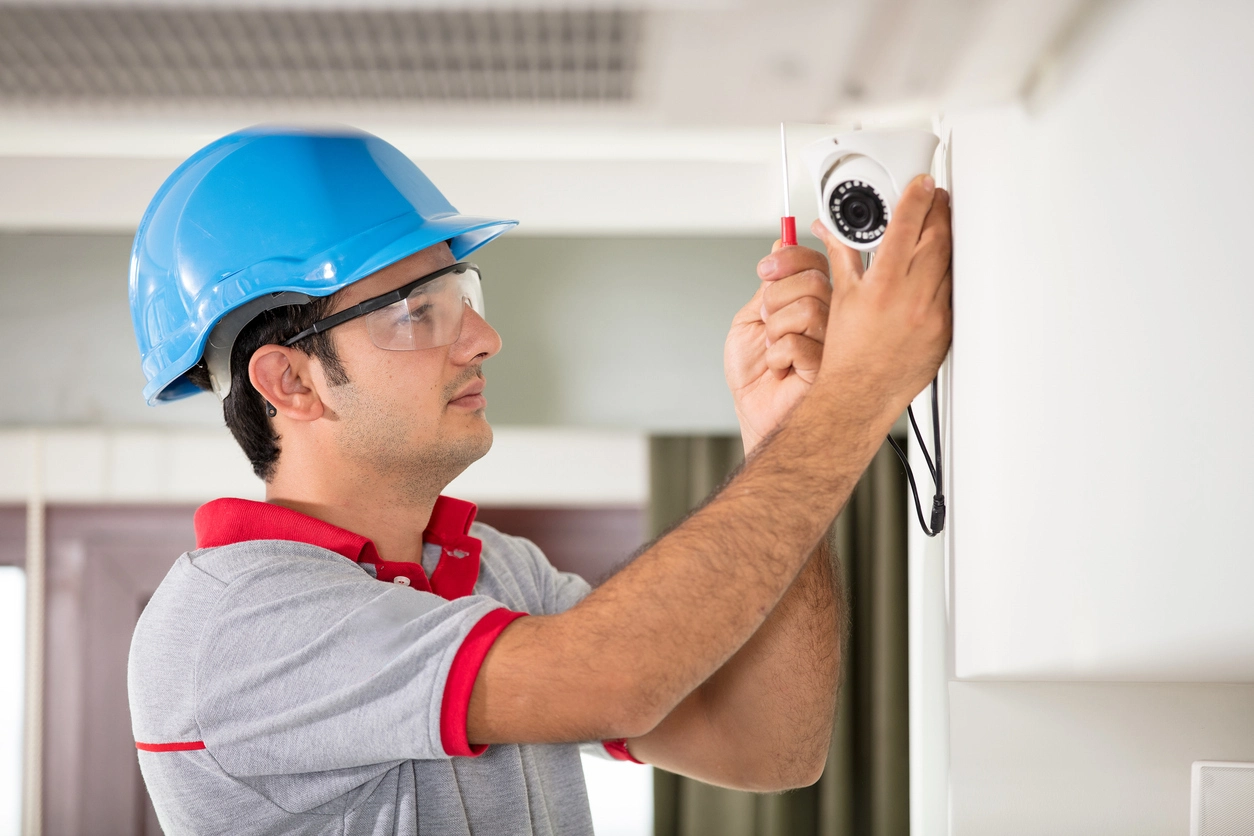 Power over Ethernet security camera installed in office building hallway