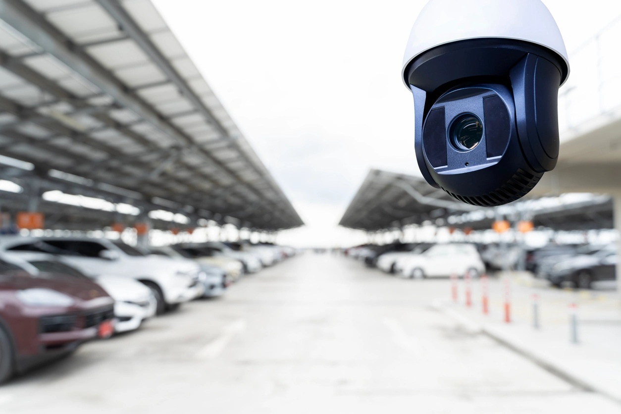 PTZ security camera monitoring large commercial parking lot