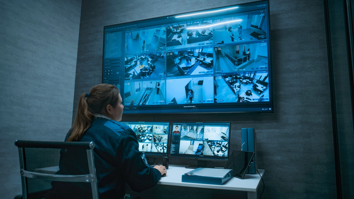 authorized school staff reviewing nearby security cameras after a specialty sensor alert
