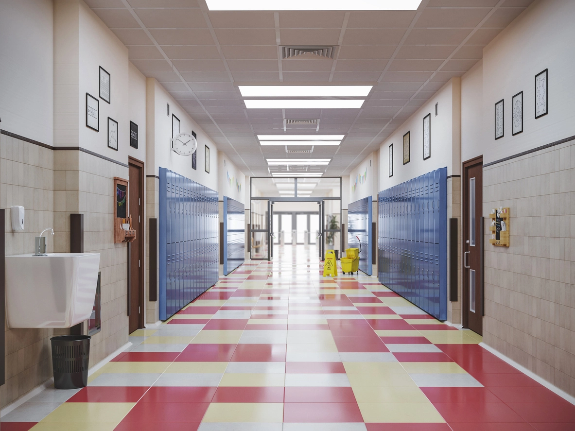 vandal proof dome security camera installed in school hallway