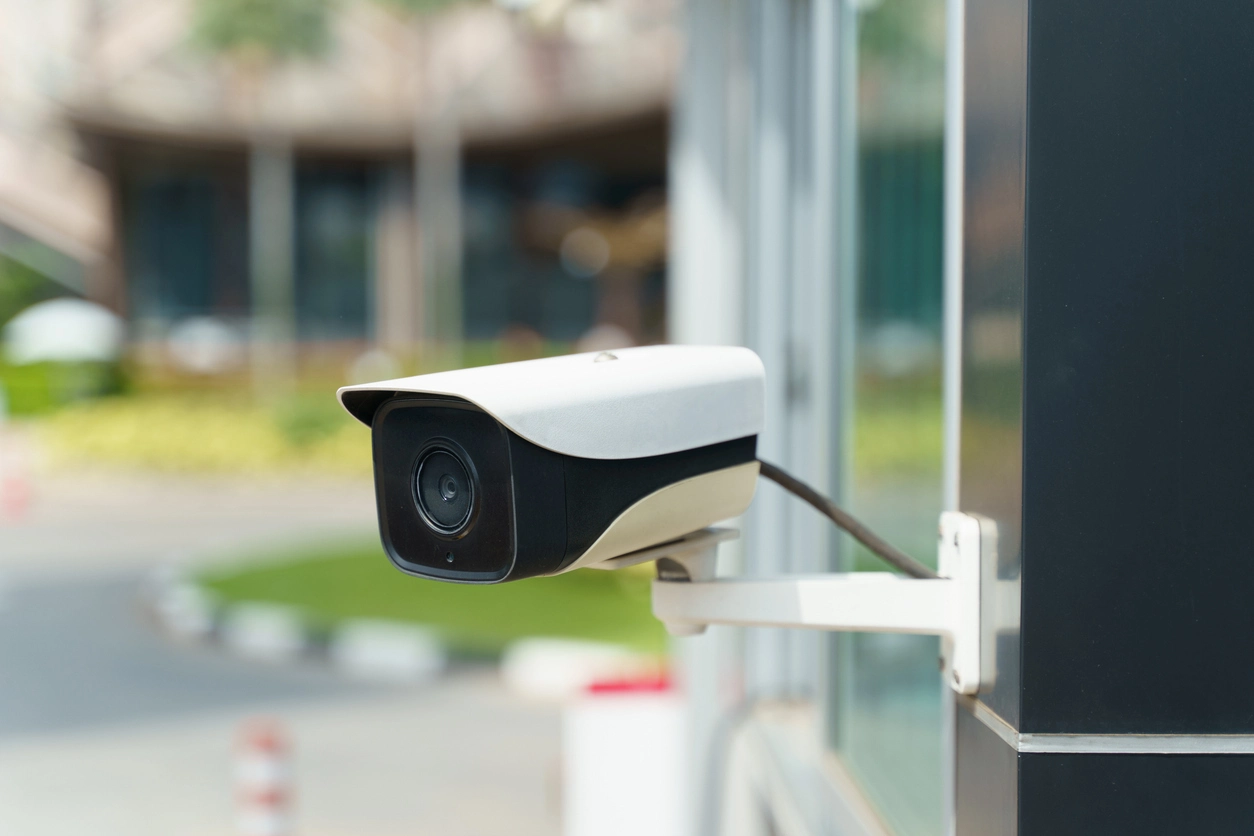 weatherproof camera mounted above commercial building entrance
