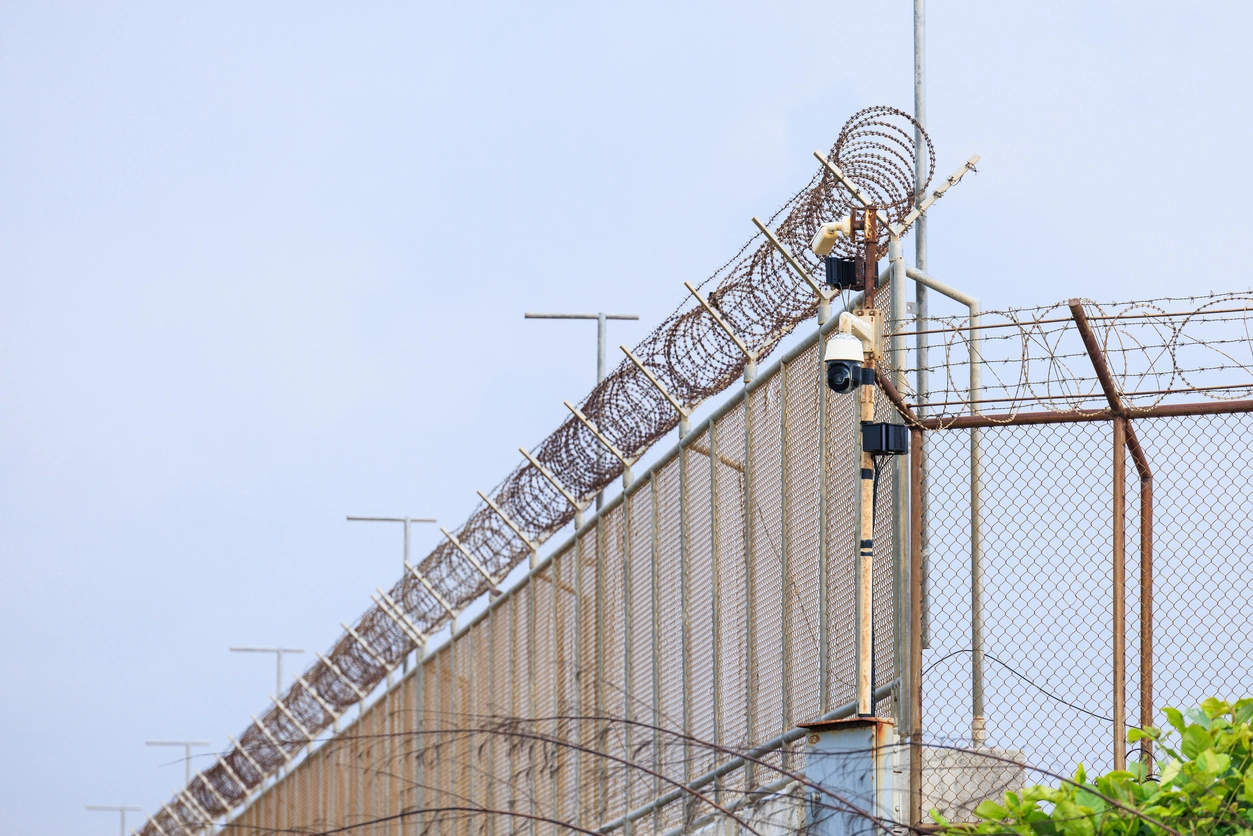 security camera monitoring controlled entrance at correctional facility