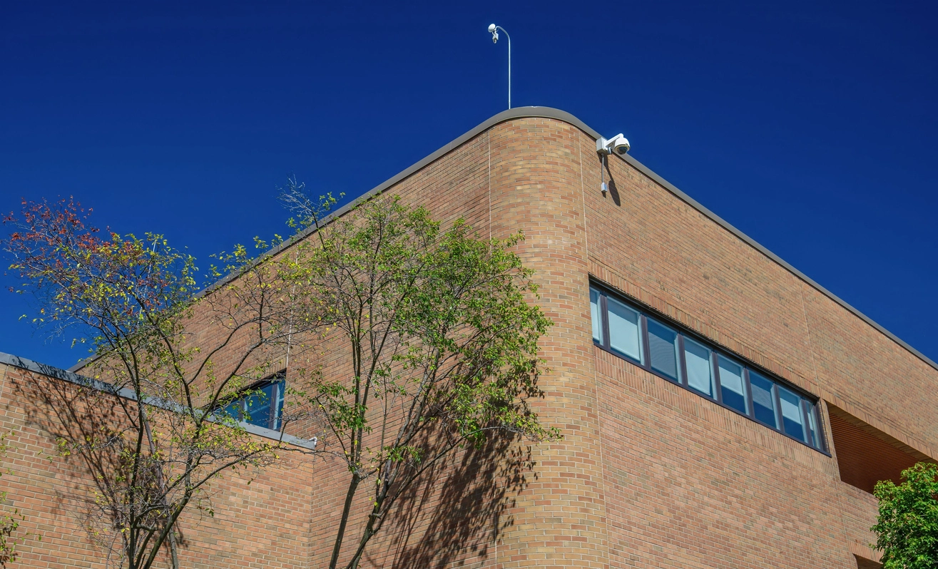 Government building entrance monitored by commercial security cameras