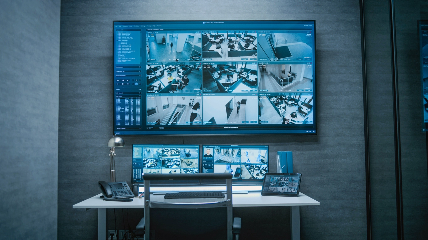 security monitoring room reviewing courthouse surveillance camera feeds