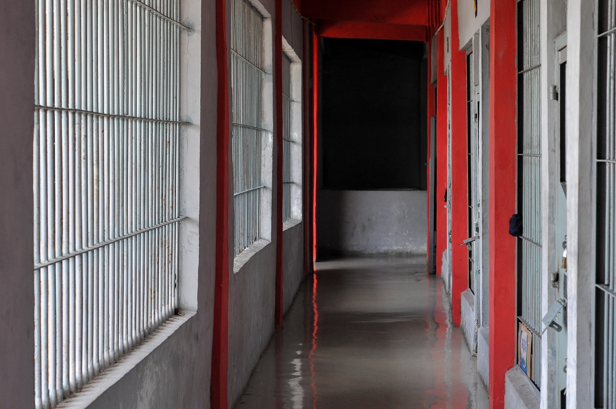 security camera monitoring controlled access door in jail facility