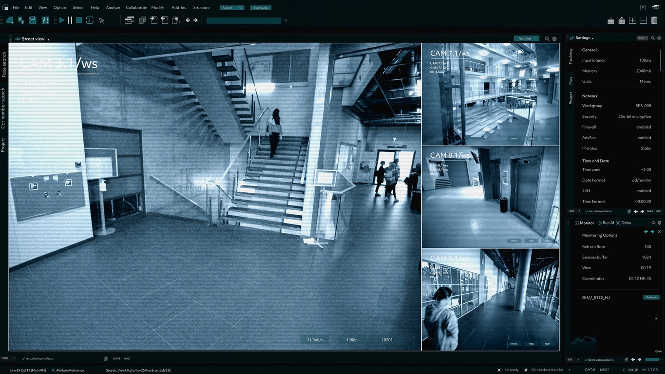 school administrator reviewing auditorium surveillance camera feeds