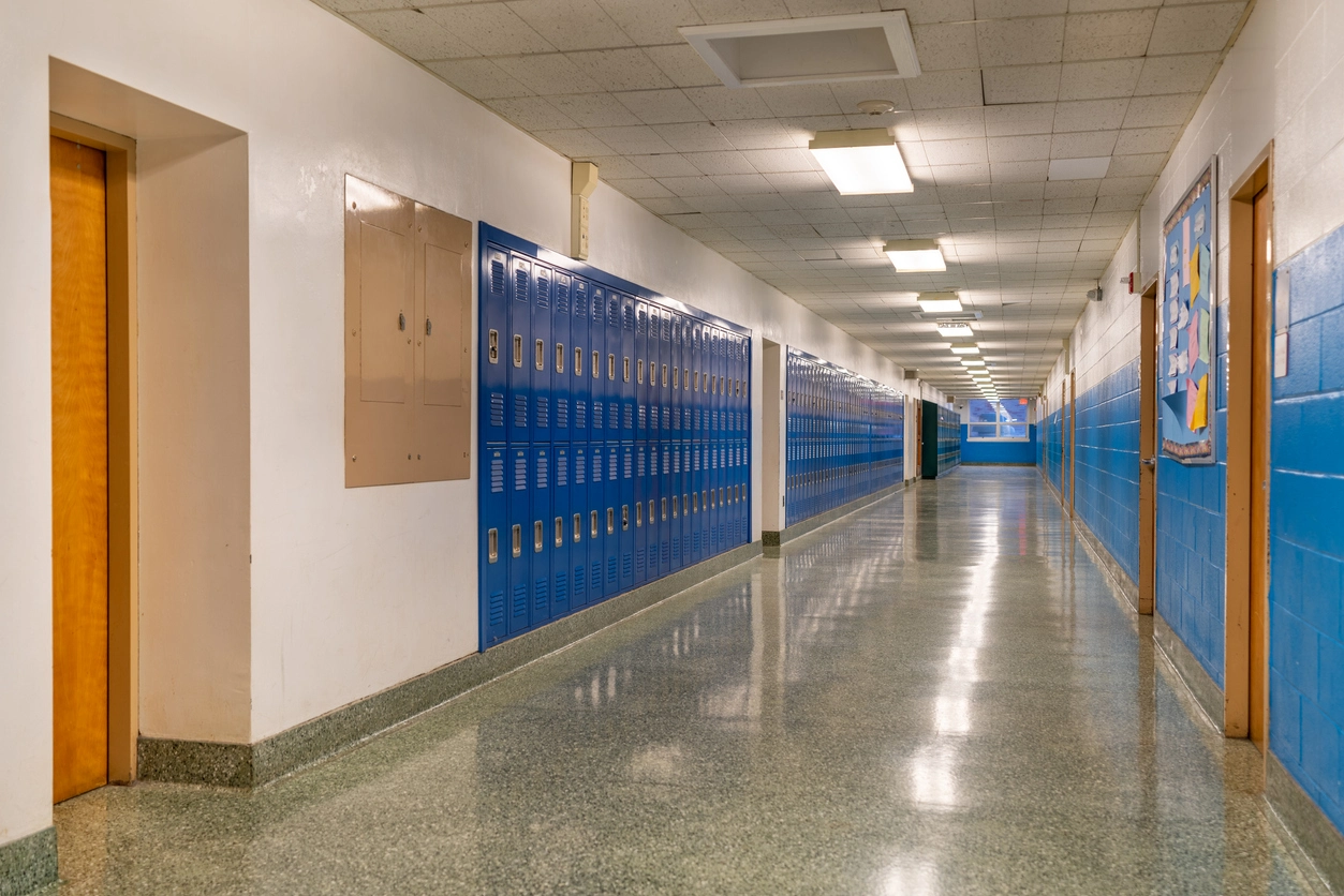 security camera installed in school common area near entrance and hallway