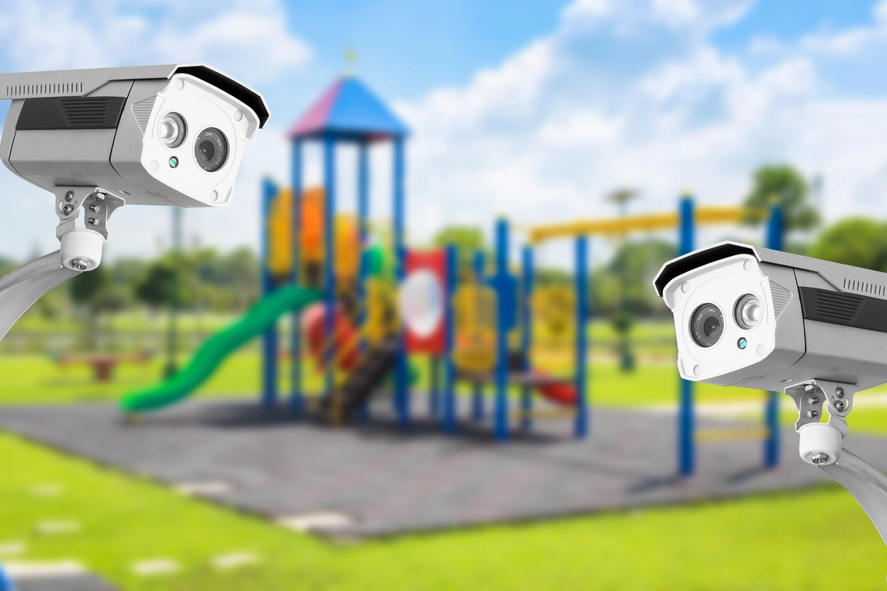 security camera monitoring school playground gate and fence