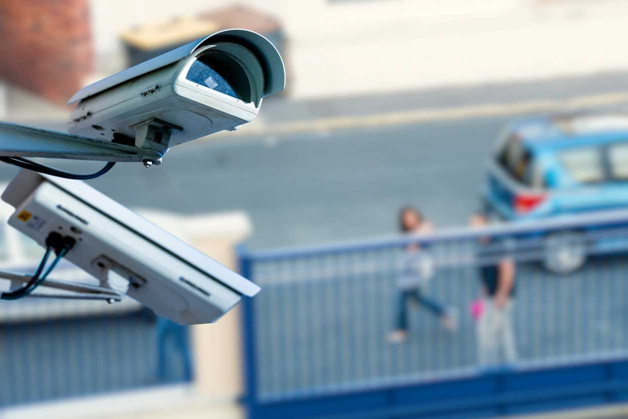 outdoor security camera monitoring playground area near school parking lot
