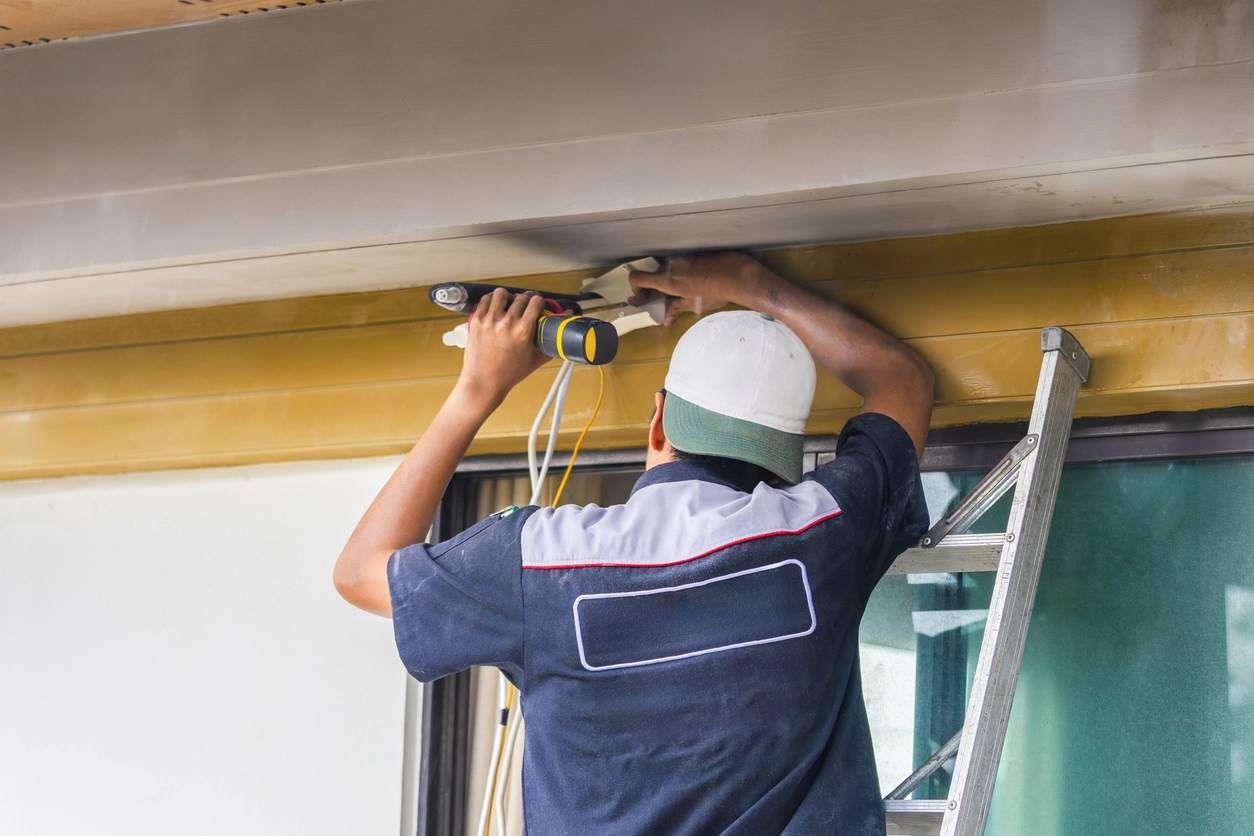 technician running structured cabling for commercial security camera installation