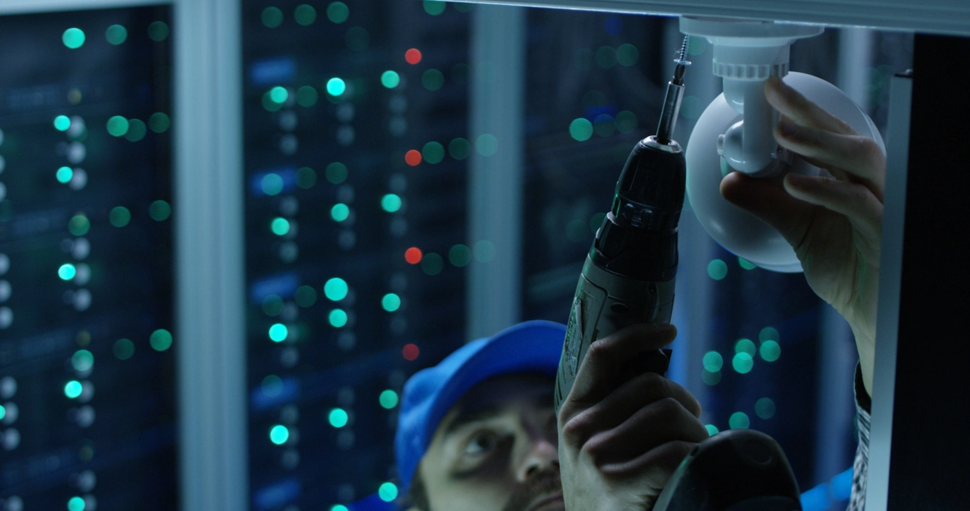 security camera technician reviewing NVR storage and recorded surveillance footage